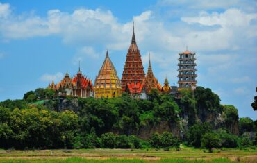 Stunning view of Wat Tham Suea temple in Thailand surrounded by lush greenery.