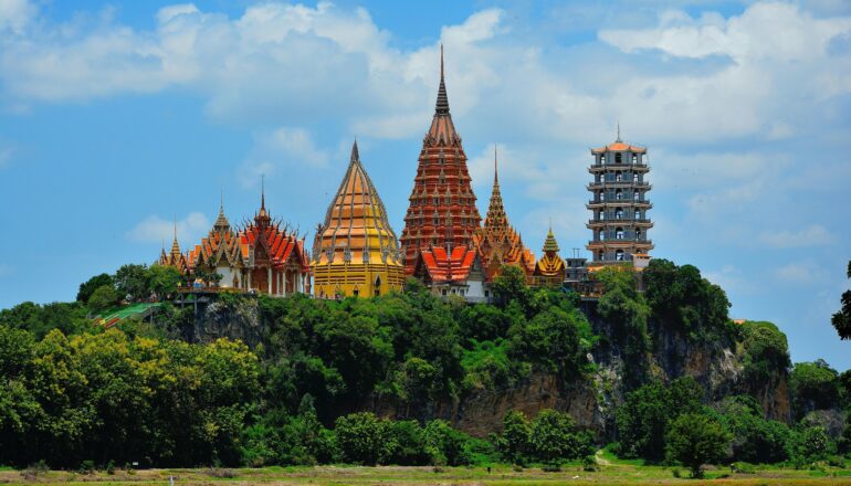 Stunning view of Wat Tham Suea temple in Thailand surrounded by lush greenery.